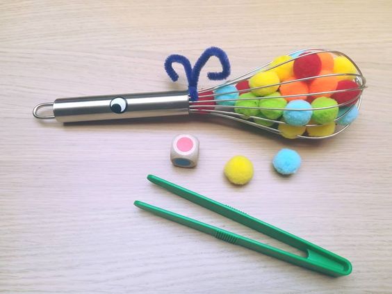 Pomponslak: dobbel en grijp met een pincet de juiste kleur uit het slakkenhuis